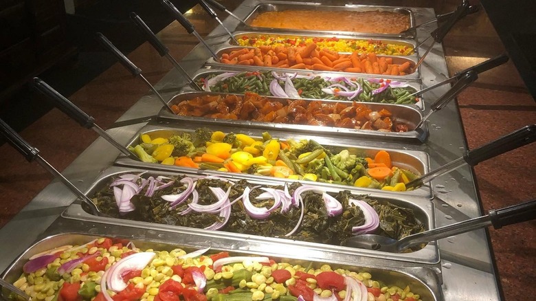 Buffet setup with various vegetables and sides at The Historic Green Manor