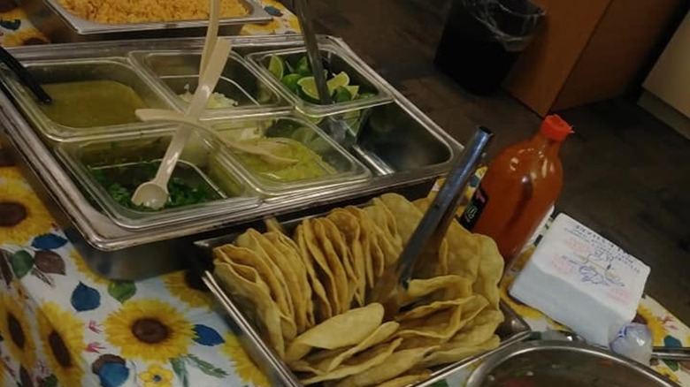 Buffet setup featuring tacos and toppings at La Fonda Mexican Buffet