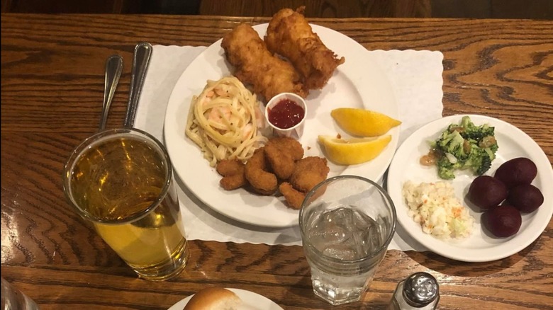 plates on dining table filled with fried items, dinner rolls, and veggie sides from buffet at Breitbach's Country Dining