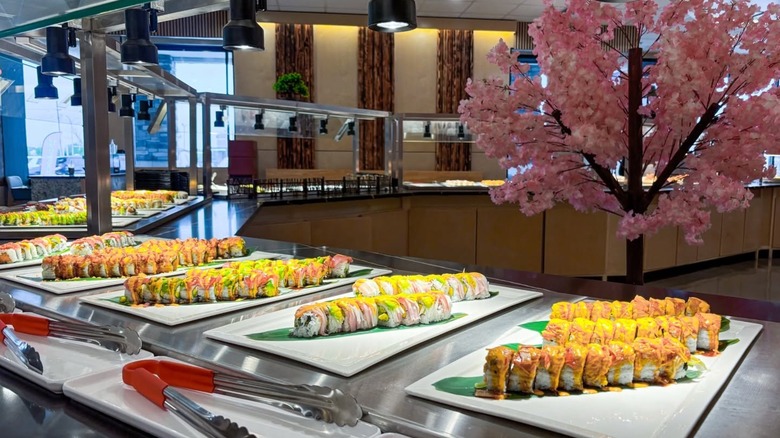 Assorted sushi trays on buffet at 69 Sushi