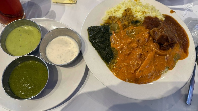 Plate with various items from buffet at Naan & Dosa