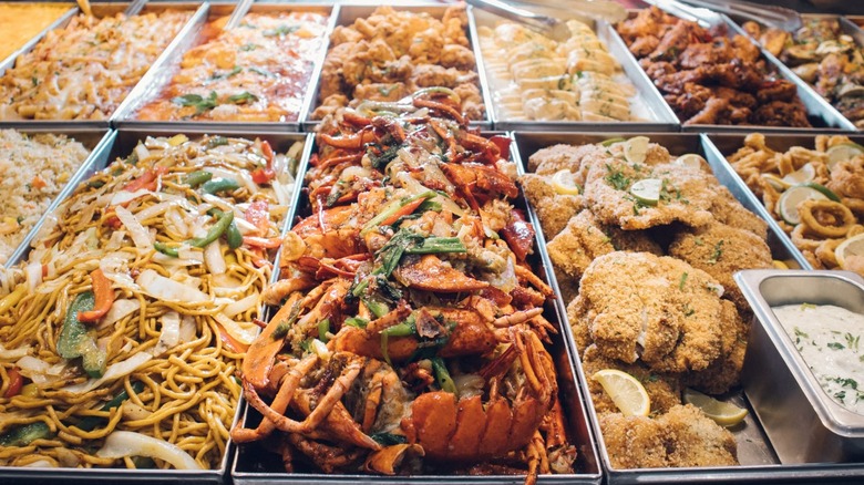 Various items like lo mein and fried rice on buffet at OLIYO restaurant