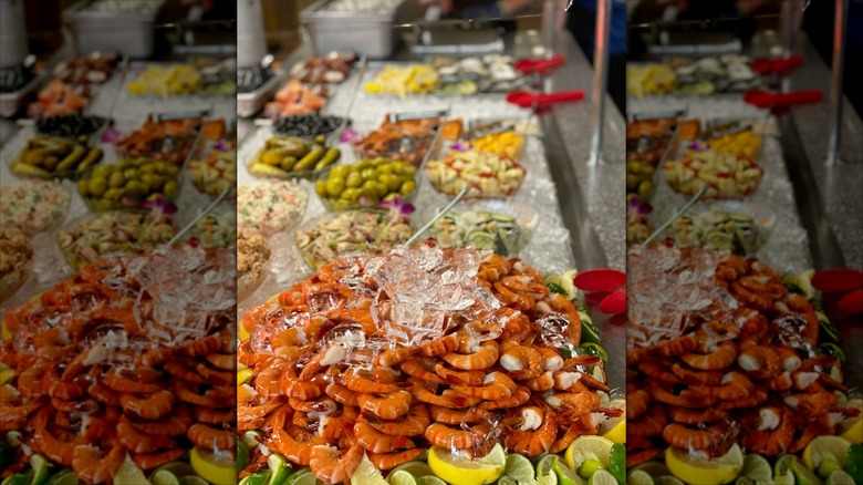 Shrimp with other various dishes blurred in background on buffet at The Nordic