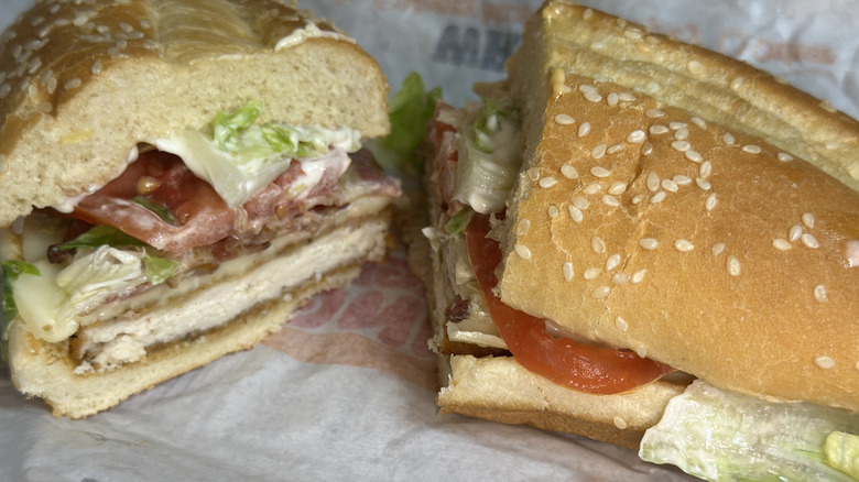 Burger King Club Original Chicken Sandwich split in half on wrapper.