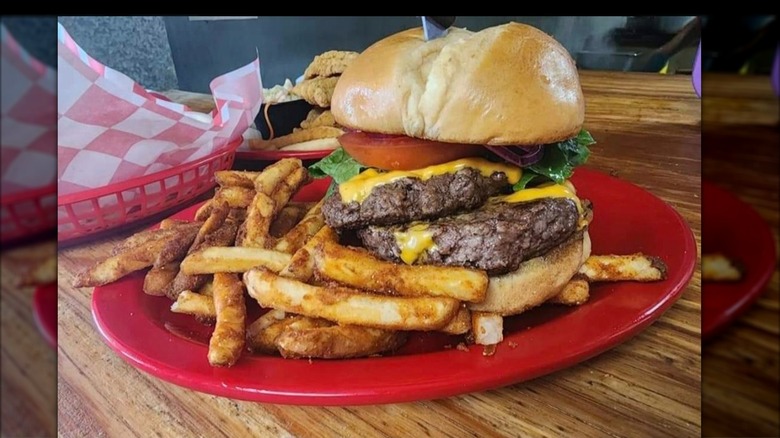 Big Daddy Burger on a plate with french fries