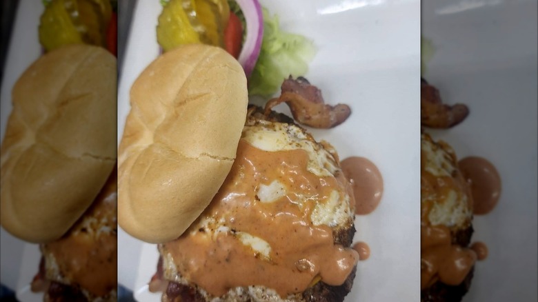 Humpback Burger on paper with the top slid back to show the inside