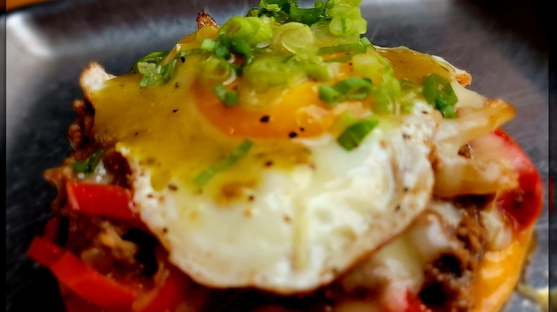Croque Garçon on a metal tray with the top bun off