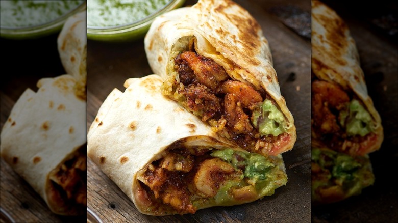 A shrimp burrito and salsa from Poquito Más