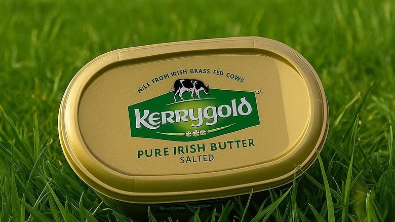 a tub of kerrygold on a bed of fresh grass