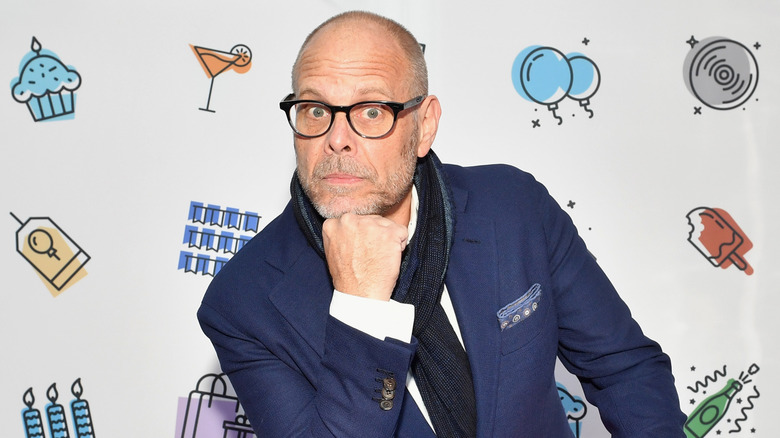 Alton Brown poses with chin on fist