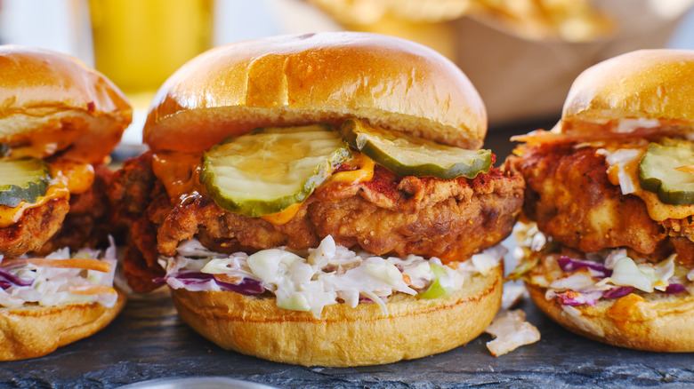 a row of fried chicken sandwiches shot close-up on a table