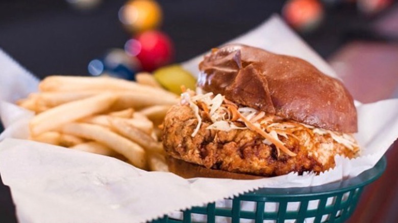 Lucky Boys Hot Chicken Sandwich with fries in a basket