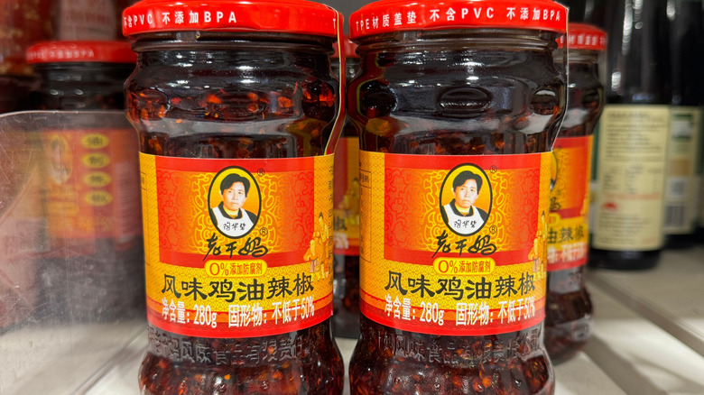 Jars of Lao Gan Ma chili crisp on a grocery store shelf