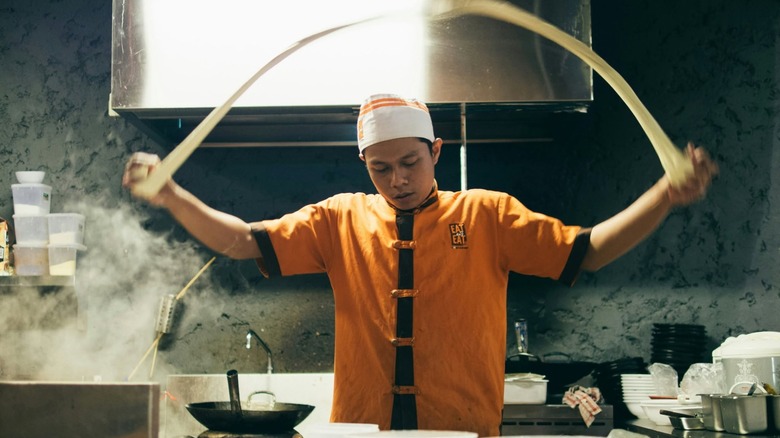 Chef at Kungfu Noodles pulling noodles.