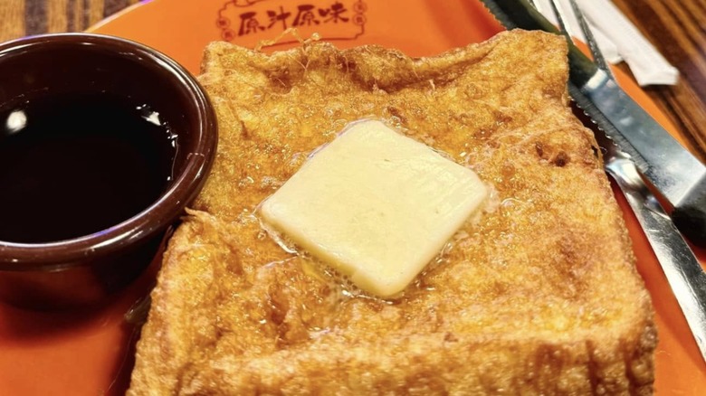 Hong Kong-style French toast with side of syrup from Alice's Kitchen.