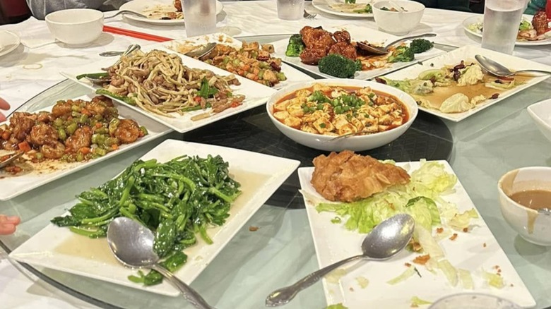 Assorted Chinese dishes arranged on a dining table at Trizest Spicy Sichuan Restaurant.