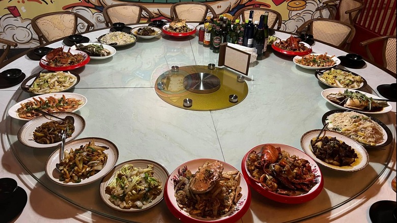 Various Chinese dishes arranged on a circular table at Old Li's Restaurant.
