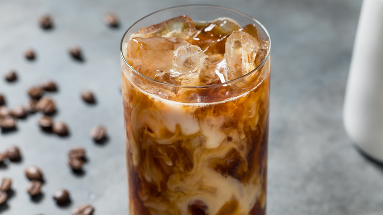 Glass of cold brew and milk over ice