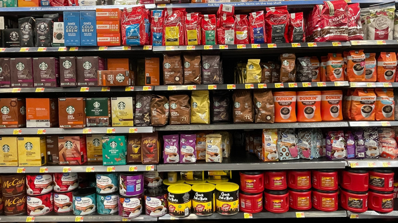 Selection of coffees in coffee aisle at grocery store
