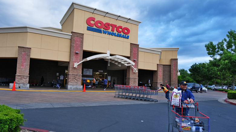 Costco warehouse, exterior, shopper with cart