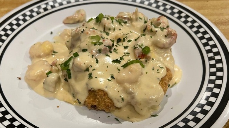 Crab Cake Pontchartrain on plate at Cafe Arcadiana
