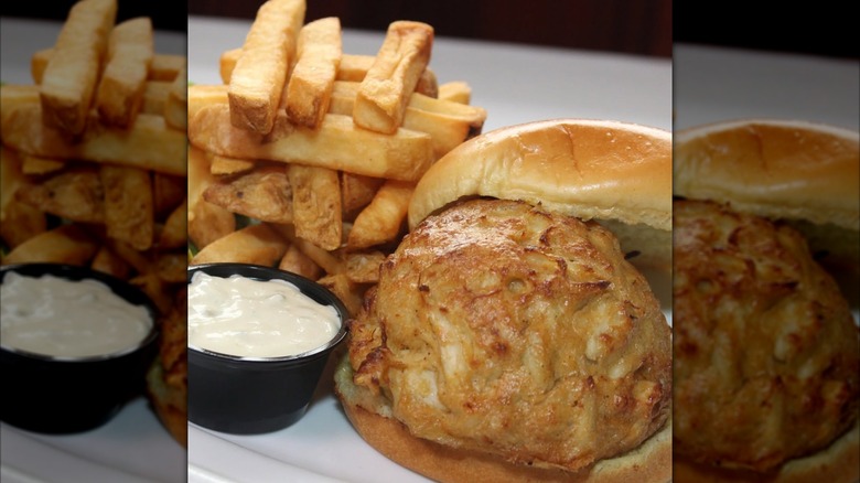 Crab cake sandwich with side of French fries at G&M Restaurant