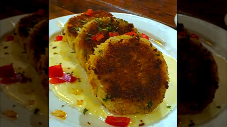 Plate of Crab Cakes with sauce at Nola's Creole and Cocktails
