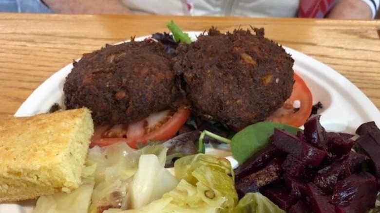 Crab Cake Plate from Stono Market and Tomato Shed Cafe with a side of beets, salad, and cornbread
