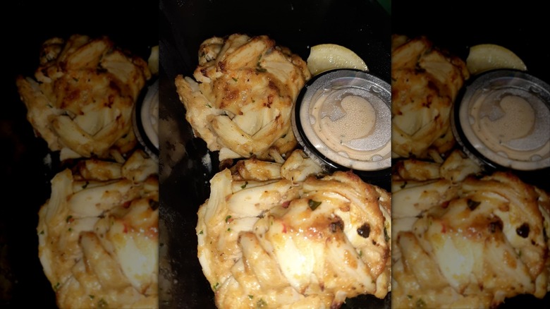 Crab Cakes with sauce and lemon wedges at Loch Bar