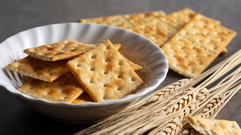 Bowl of wheat crackers with ears of wheat