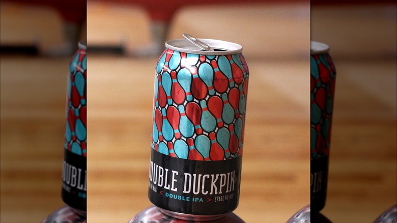 Double Duckpin beer can with blue and red bowling pin design on can