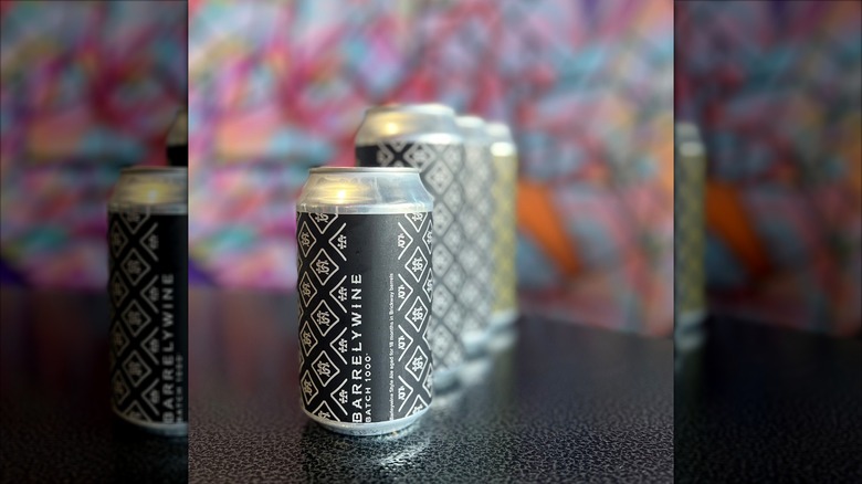 Row of Barrelywine black beer cans