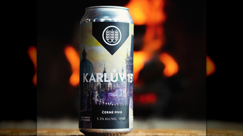 Karlův 13° beer can with bonfire in background