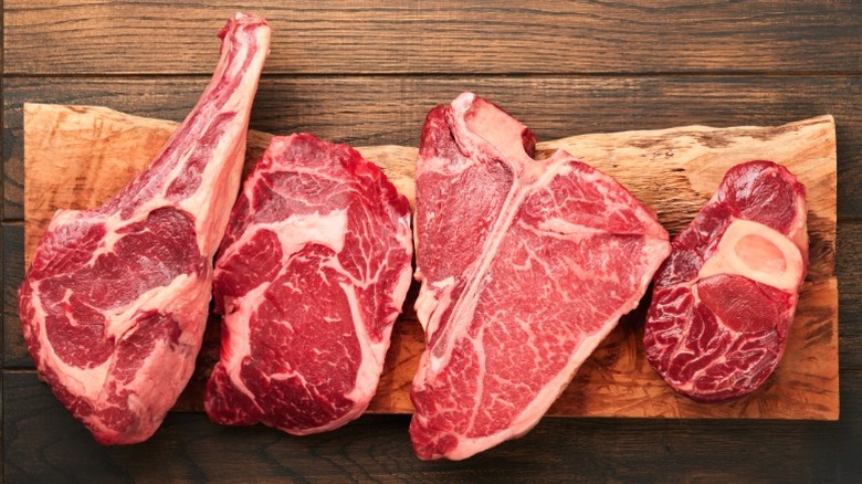 An assortment of fatty steak cuts.