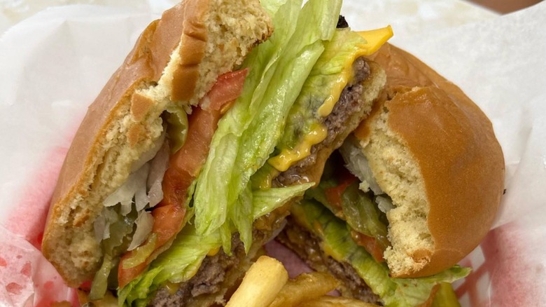 Duane Purvis burger cut in half from Triple XXX Family Restaurant