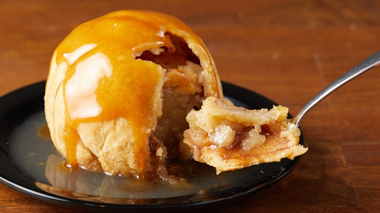 Apple dumpling being scooped into with a fork from Smokey D's BBQ