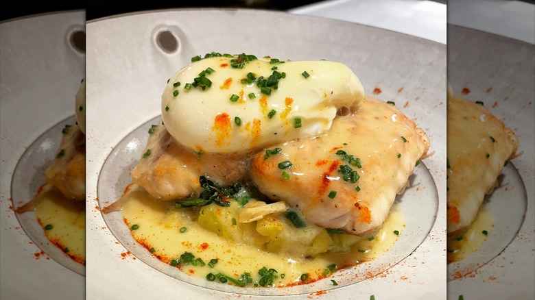Pan Seared Australian Barramundi, Poached Egg, Smashed Yukon Gold Potatoes, Sautéed Spinach and Shallots, Chive Beurre Blanc and Smoked Paprika  from Joseph's Culinary Pub