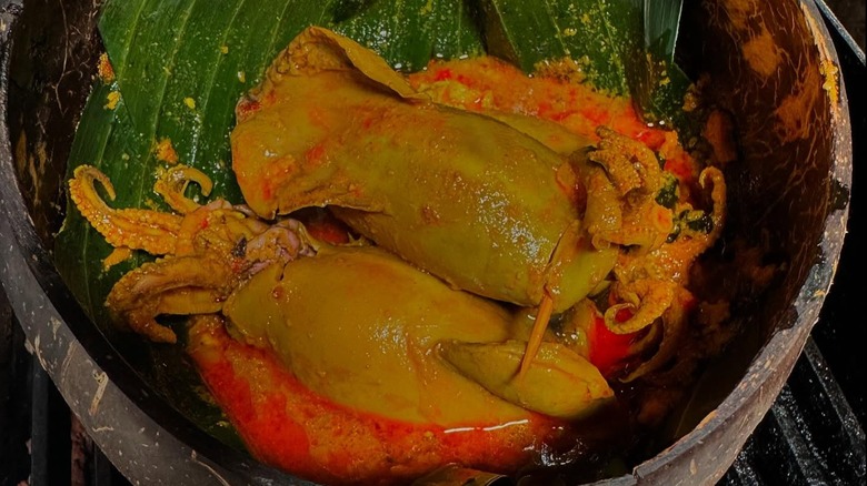 Special from Hardena. Gulai Cumi. Squid gently simmered in a coconut curry with a touch of lemon basil