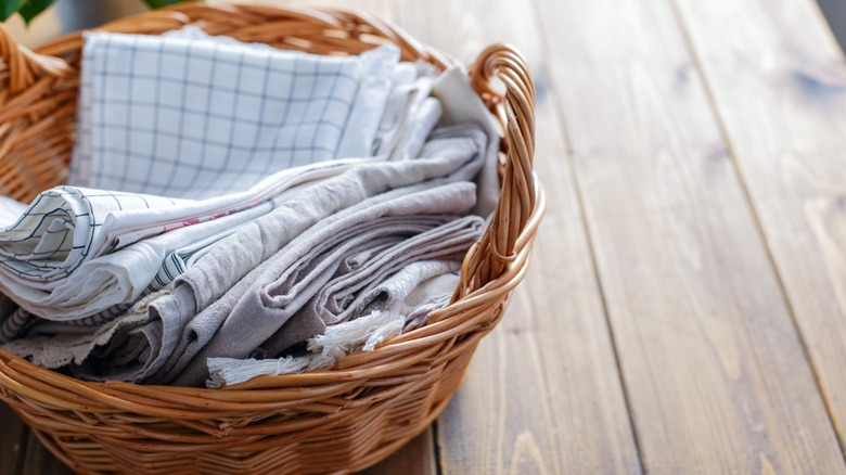 A pile of dish towels in a basket