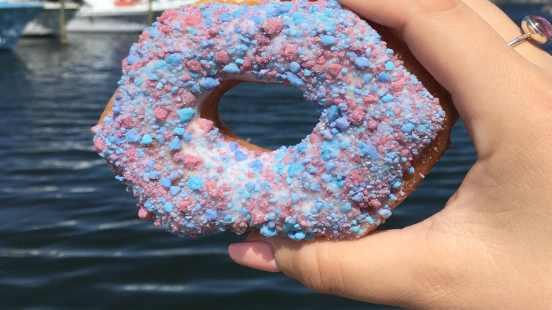 Donut held in air