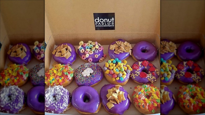 Purple glazed donuts in a box