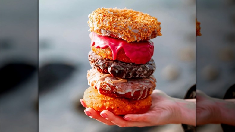Stacked donuts in hand
