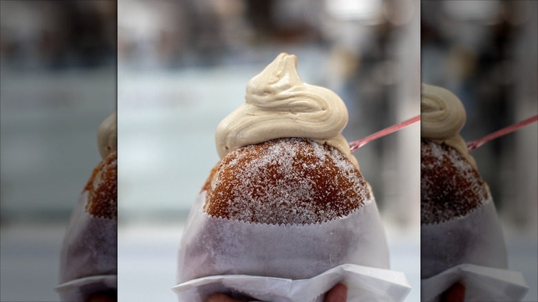 Sugared donut with cream on top