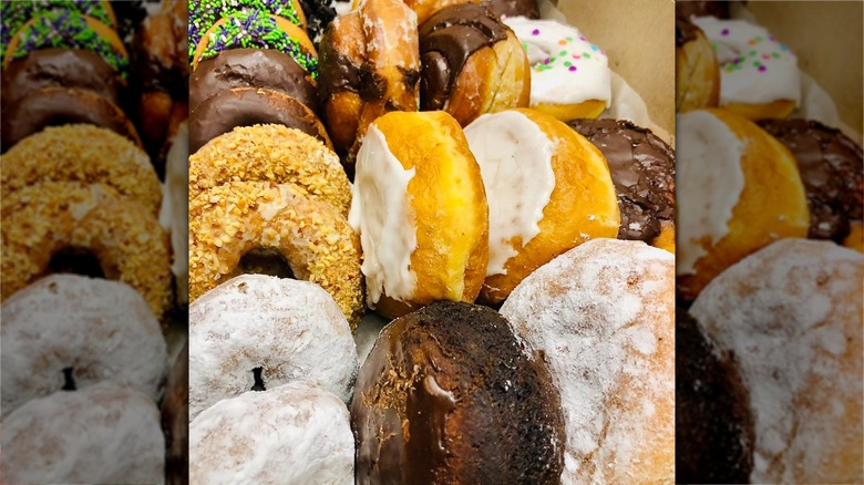 Rows of iced donuts in a box