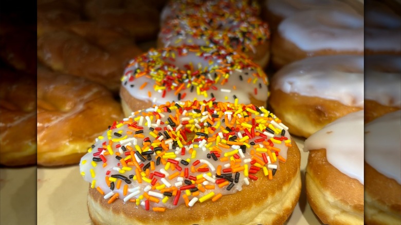 Donuts with orange, red, and yellow sprinkles