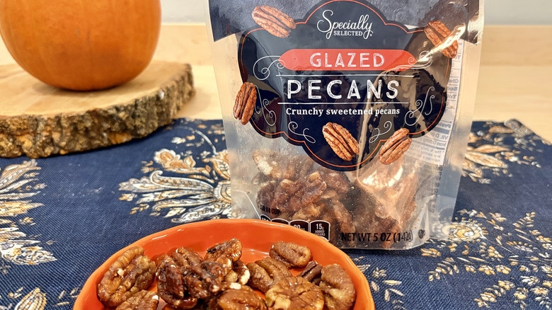 A bag and plate of Aldi glazed sweet pecans