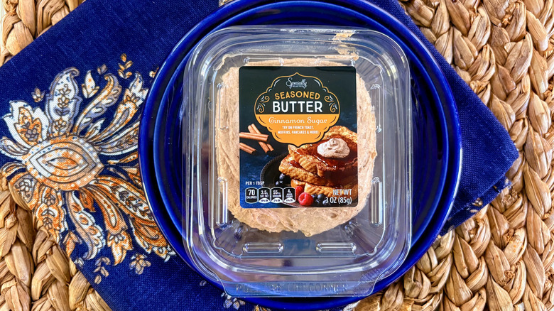 A container of Aldi cinnamon sugar seasoned butter on a plate