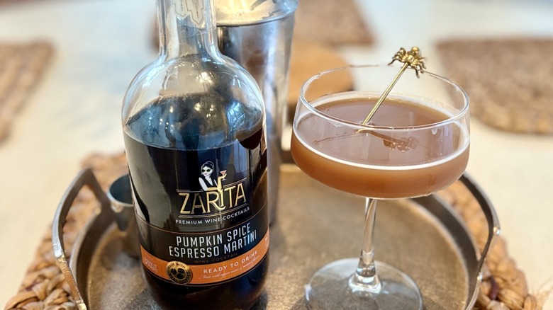 A tray with Aldi Zarita pumpkin spice espresso martini and a coupe glass