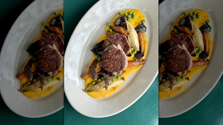 Veal plate on vegetables and cream