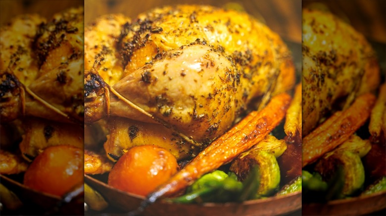 Roasted chicken atop vegetables